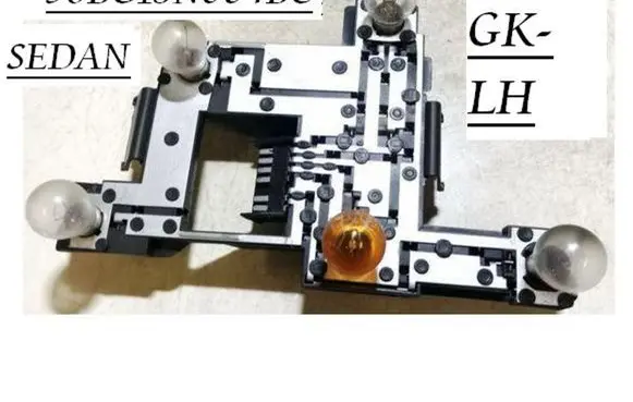 Tail light bulb cover holder