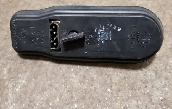 Tail light bulb cover holder