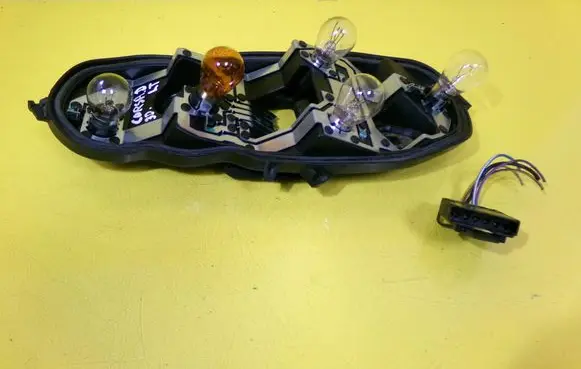 Opel Corsa D Tail light bulb cover holder 89037853A