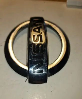 Nissan Titan Manufacturer badge logo/emblem 934957S200