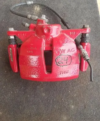 Volkswagen Golf VII Front brake caliper