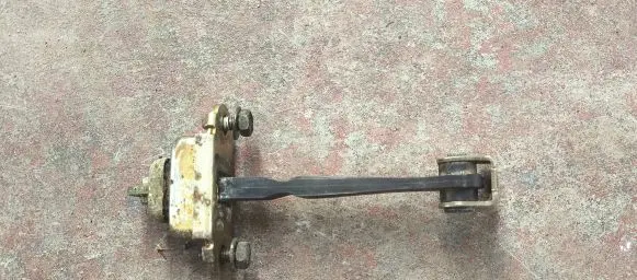 Nissan Primera Front door check strap stopper