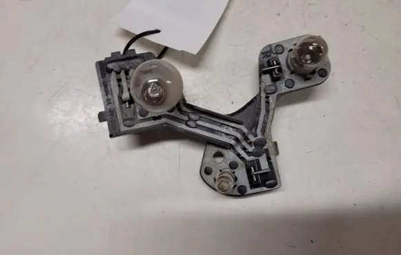 Tail light bulb cover holder