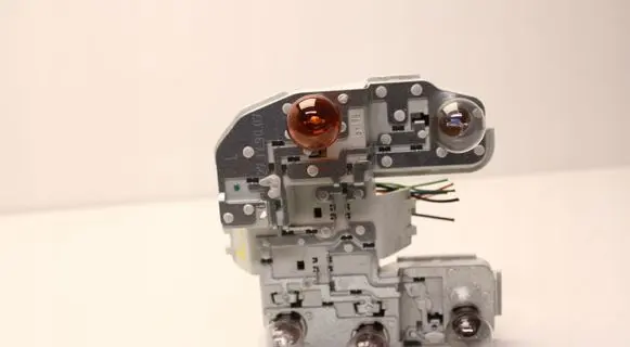 Tail light bulb cover holder
