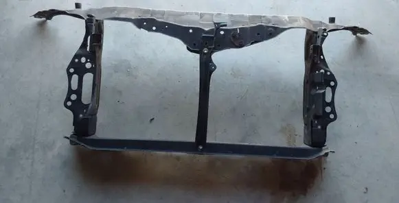Radiator support slam panel
