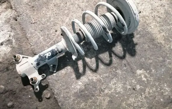 Nissan Primera Front shock absorber with coil spring