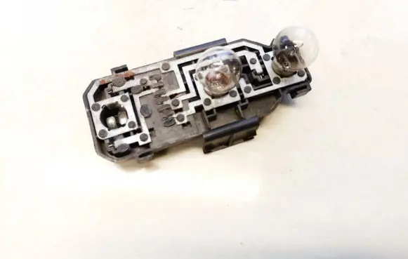 Tail light bulb cover holder