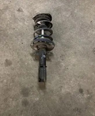 Renault Megane III Front shock absorber with coil spring