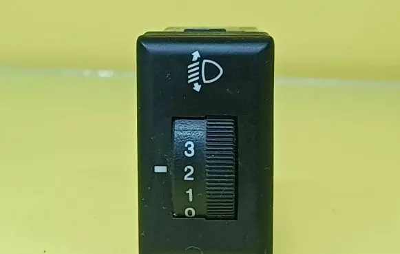 Headlight level height control switch