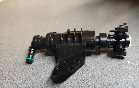 Hyundai Tucson TL Headlight washer spray nozzle