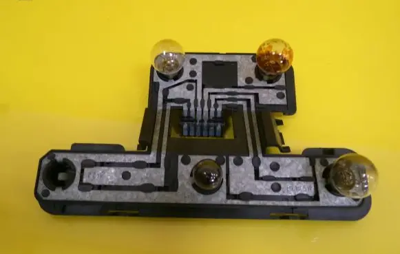 Tail light bulb cover holder