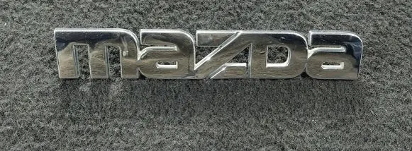 Mazda 323 F Manufacturers badge/model letters BE5R51710