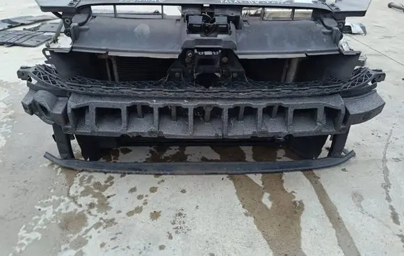 Radiator support slam panel