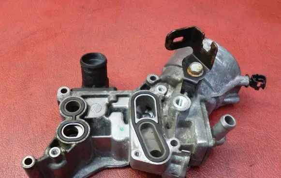 Opel Corsa D Oil filter mounting bracket