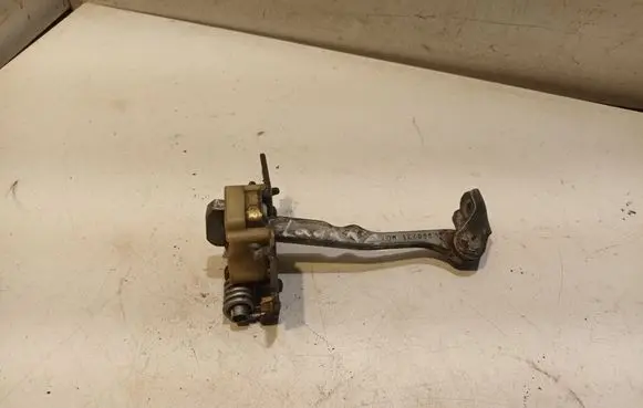 Front door check strap stopper