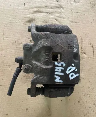 Nissan Juke I F15 Front brake caliper