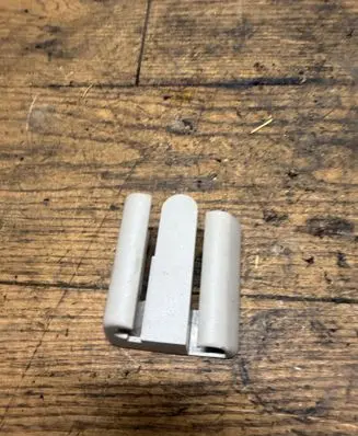 Front passenger seat rail trim