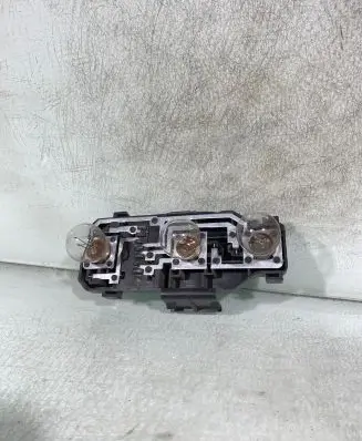 Tail light bulb cover holder