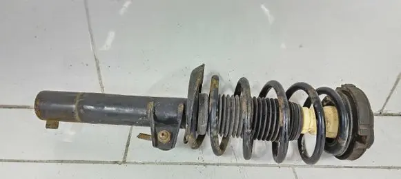 Volkswagen Caddy Front shock absorber with coil spring