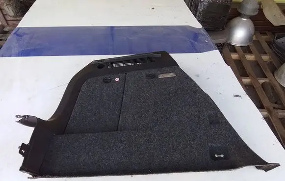 Trunk/boot lower side trim panel