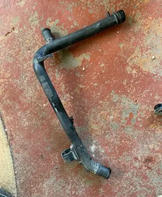 Volkswagen Golf VI Engine coolant pipe/hose 03L121065AJ