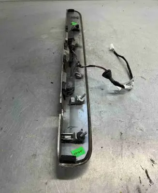 Trunk door license plate light bar
