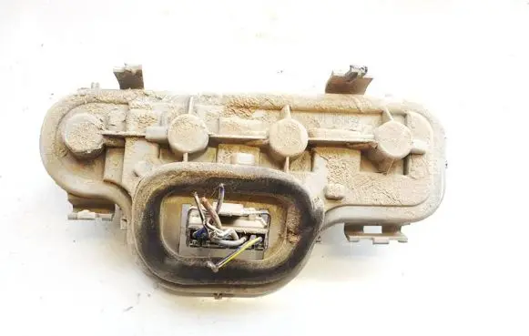 Tail light bulb cover holder