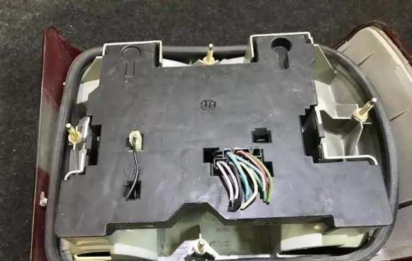 Volvo 850 Tail light bulb cover holder