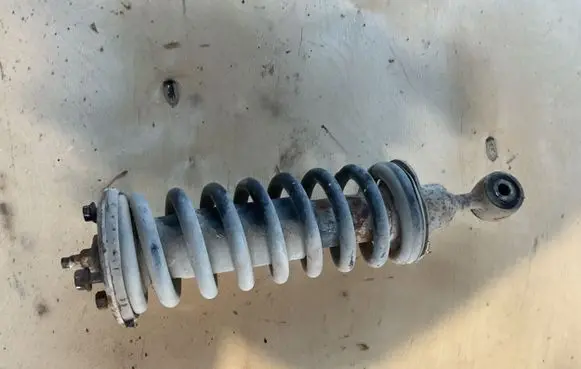 Nissan Pathfinder R51 Front shock absorber with coil spring