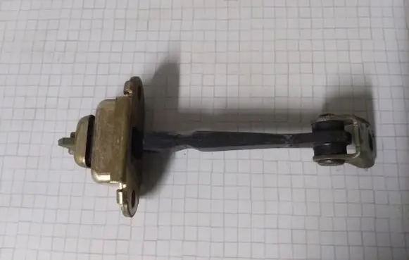 Nissan Primera Front door check strap stopper