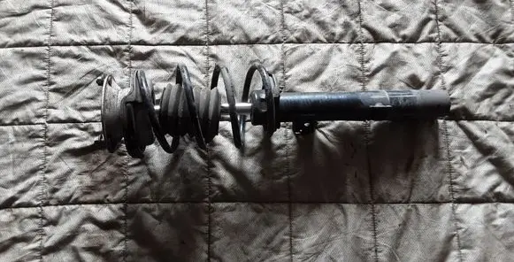 Front shock absorber with coil spring