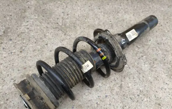 Volkswagen Tiguan Allspace Front shock absorber with coil spring 5QF413031AS