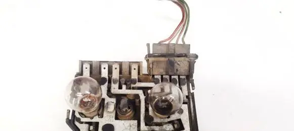 Tail light bulb cover holder