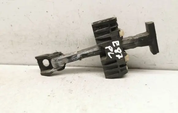 Front door check strap stopper