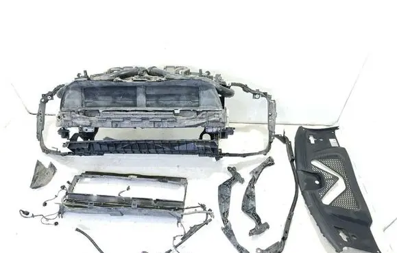Radiator support slam panel
