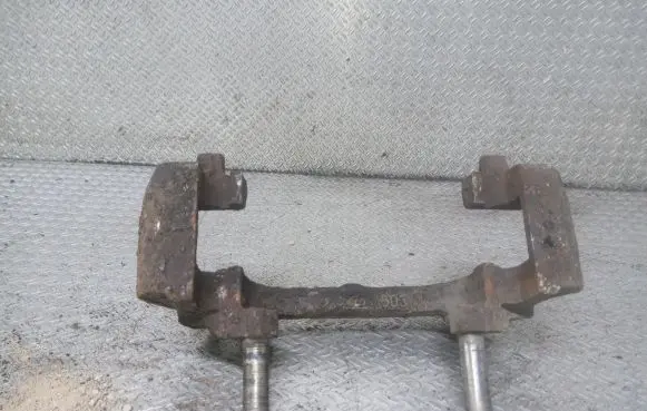 Volvo S60 Front Brake Caliper Pad/Carrier 
