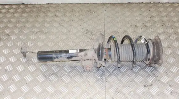 Volkswagen Golf VII Front shock absorber with coil spring 5Q0413023FJ