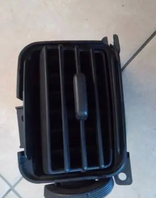Nissan NV200 Dash center air vent grill 68750-JX30A