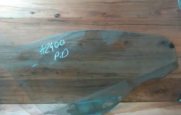 Mazda 323 Front door window glass four-door