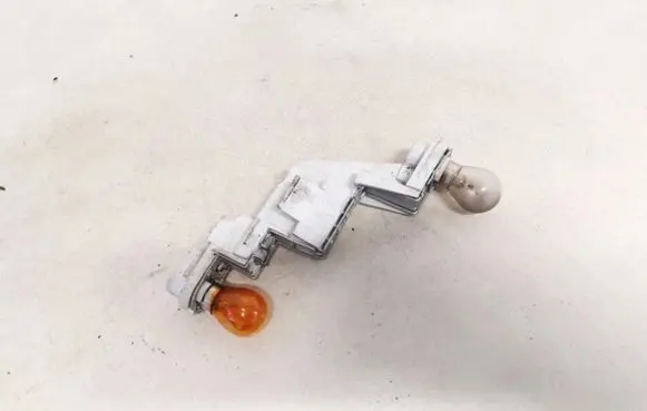 Volvo V50 Tail light bulb cover holder