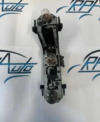 Tail light bulb cover holder
