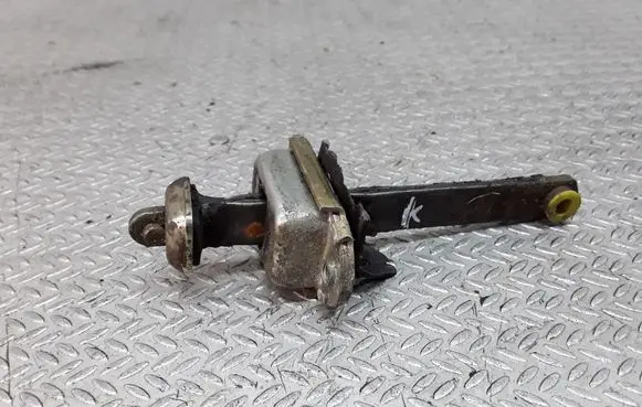 Front door check strap stopper
