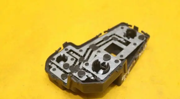Tail light bulb cover holder