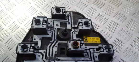 Tail light bulb cover holder