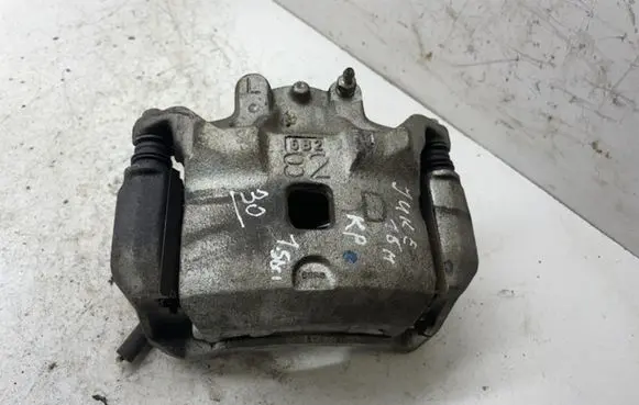 Nissan Juke I F15 Front brake caliper