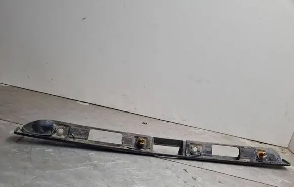 Volkswagen Golf III Trunk door license plate light bar 1H6827577