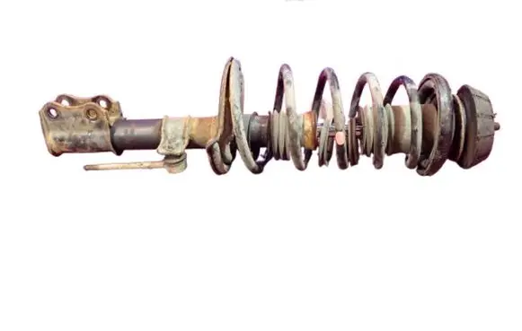 Suzuki Swift I Front shock absorber with coil spring