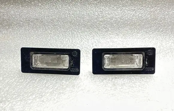 Volkswagen PASSAT B6 Number plate light 810943021