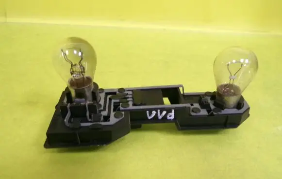Nissan Primera Tail light bulb cover holder