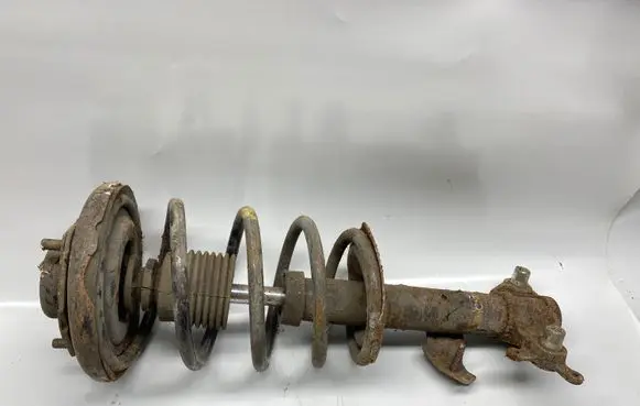 Nissan Primera Front shock absorber with coil spring